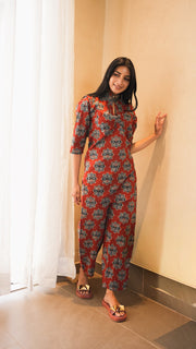 Woman wearing a rust medallion-print cotton kurta with dhoti pants