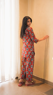 Woman wearing a rust medallion-print cotton kurta with dhoti pants